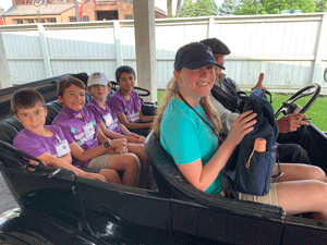 Students with Camp Counselor in a Model T