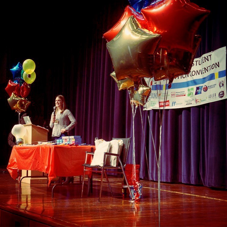 Anneliese Gegenheimer presenting onstage at Chicago Student Invention Convention